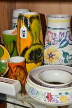 A COLLECTION OF POOLE POTTERY, eight pieces including Delphis and Traditional patterns, height of