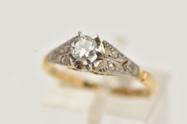 A SINGLE STONE DIAMOND RING, a round brilliant cut diamond prong set in white metal, leading onto