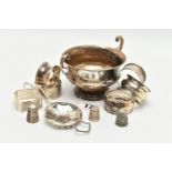 A SMALL PARCEL OF SILVER, comprising six assorted napkin rings, a late Victorian thimble, a George V