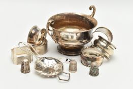 A SMALL PARCEL OF SILVER, comprising six assorted napkin rings, a late Victorian thimble, a George V