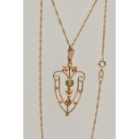 AN EDWARDIAN PENDANT AND CHAIN, open work floral pendant, set with a circular cut peridot, missing