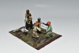 A COLD PAINTED BRONZE OF THREE CHILDREN DANCING AFTER BERGMAN, with fourth child playing a pipe