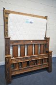 A HARDWOOD RUSTIC STYLE 5FT BEDSTEAD, with slatted base and side rails, band a Silentnight 4ft6