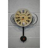 A TWIN SPRUNG WALL CLOCK, the enamel dial with roman numerals (condition report: untested, dial