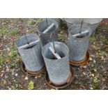 FOUR GALVANISED METAL CHICKEN FEEDERS, with hanging hooks, two marked Eltex, height 64cm (