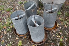 FOUR GALVANISED METAL CHICKEN FEEDERS, with hanging hooks, two marked Eltex, height 64cm (