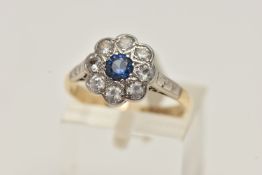 A CLUSTER RING, designed as a central circular blue paste within a colourless paste surround,