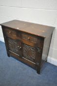 A CARVED OAK SIDEBOARD, with two drawers, width 93cm x depth 42cm x height 82cm (condition: good)