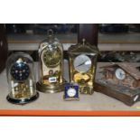 A GROUP OF CLOCKS, to include three Kern and Schatz mid twentieth century anniversary clocks, a