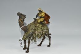 A COLD PAINTED BRONZE OF AN ARAB ON A CAMEL WITH LION ATTACKING AFTER BERGMAN, unmarked, height 17cm