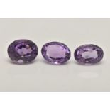 THREE LOOSE OVAL CUT AMETHYSTS, largest stone measures approximately 12mm length x 9.5mm width,