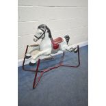 A VINTAGE SPRUNG CHILDS ROCKING HORSE (condition report: missing handles, well used condition)