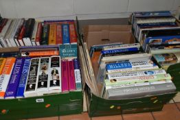 FOUR BOXES OF BOOKS containing approximately ninety-five titles in hardback and paperback formats,
