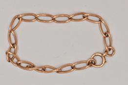 A YELLOW METAL CURB LINK BRACELET, each link stamped 15.625, fitted with a bolt spring clasp, length