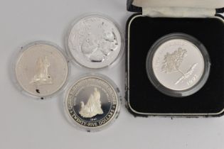 A BAG OF COINS, to include a cased silver 1992 Two Dollar Bermuda Elizabeth II coin in a