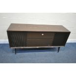 A MID-CENTURY GRUNDIG RADIOGRAM, with a turntable and stereo, on square tapered legs, length 147cm x