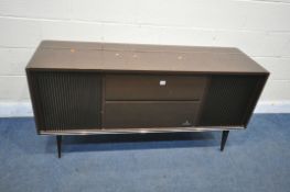 A MID-CENTURY GRUNDIG RADIOGRAM, with a turntable and stereo, on square tapered legs, length 147cm x