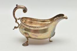 AN EDWARD VIII SILVER SAUCE BOAT, gadrooned rim, three feet, acanthus handle, hallmarked 'Goldsmiths