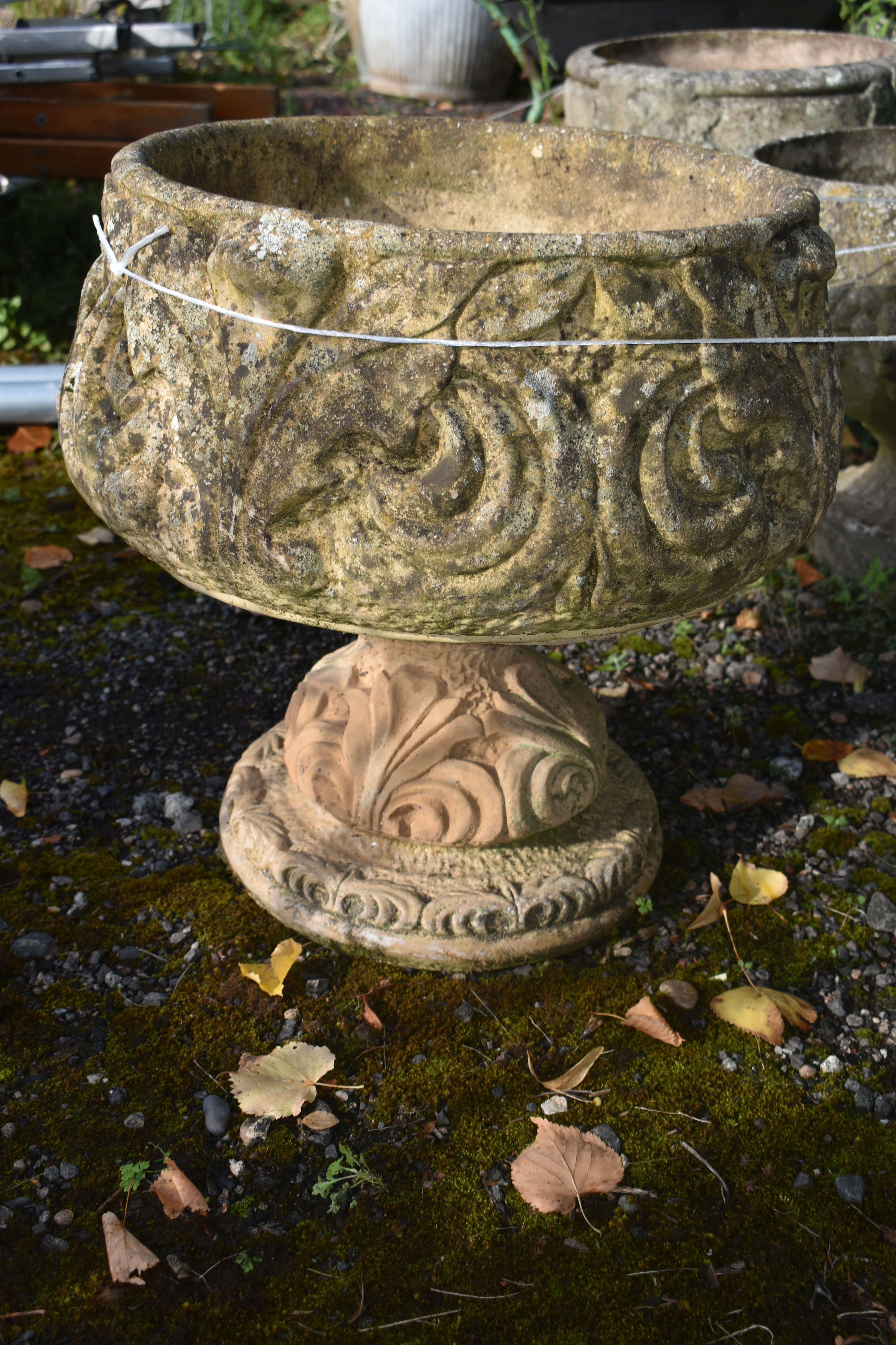 A PAIR OF COMPOSITE GARDEN URNS, with scrolled and foliate details, on a separate base, diameter - Image 2 of 2