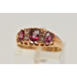 AN EARLY 20TH CENTURY RUBY AND DIAMOND RING, set with three graduated oval cut rubies, interspaced