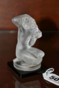 FLOREAL' LALIQUE,A FROSTED AND OPALESCENT GLASS FIGURE, of a naked kneeling woman supported by a
