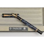 A 'PARKER' FOUNTAIN PEN, blue marble with gold tone detail, nib signed 'Parker', stamped 18k,