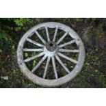 A WEATHERED CART/WAGGON WHEEL, diameter approximately 120cm (condition - weathered, losses to