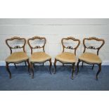 A SET OF FOUR VICTORIAN ROSEWOOD CHAIRS, with scrolled splat backs (condition report: surface