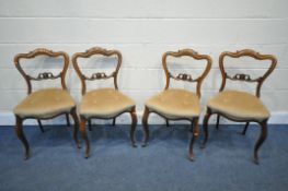 A SET OF FOUR VICTORIAN ROSEWOOD CHAIRS, with scrolled splat backs (condition report: surface