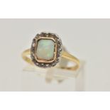 A YELLOW METAL OPAL AND DIAMOND CLUSTER RING, of a rectangular form, centrally set with a