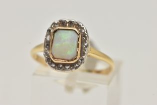 A YELLOW METAL OPAL AND DIAMOND CLUSTER RING, of a rectangular form, centrally set with a