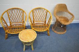 A WICKER BASKET CHAIR, on a circular tapered base, a pair of wicker conservatory armchairs, and a