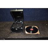 A COLUMBIA TABLETOP WIND UP GRAMAPHONE with black leather effect covering and three 12in 78s (