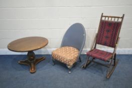AN EDWARDIAN STAINED BEECH FOLDING ROCKING CHAIR, with a needlework back and seat, along with a