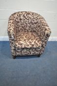 A BEIGE AND PURPLE FLORAL UPHOLSTERED TUB CHAIR (condition report: minor clean needed)
