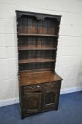 A SLIM OAK DRESSER, with two drawers, width 80cm x depth 47cm x height 187cm x height of base
