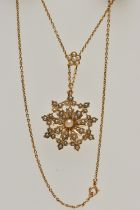 A VICTORIAN SEED PEARL PENDANT NECKLACE, the pendant of a floral design set with a central seed