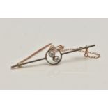 A YELLOW METAL DIAMOND BAR BROOCH, polished bar with open work centre piece set with two old cut