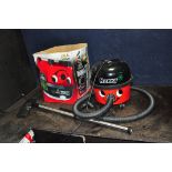 A NUMATIC HENRY HVR200A VACUUM CLEANER with original box and attachments but no angled pipe (see pic