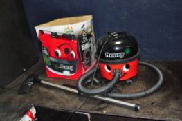 A NUMATIC HENRY HVR200A VACUUM CLEANER with original box and attachments but no angled pipe (see pic