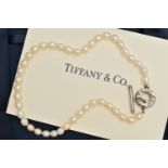 A 'TIFFANY & CO' FRESH WATER PEARL TOGGLE NECKLACE, a string of forty four oval cultured fresh water