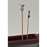 A STICKPIN AND A BROKEN BROOCH, the stickpin set with an oval turquoise cabochon within a fruit