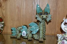 A LARGE YARE DESIGNS ENGLAND POTTERY DRAGON, with paper label to base, height 26cm x length 30cm (1)