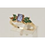 A TANZANITE AND EMERALD RING, rectangular cut tanzanite set with marquise cut emeralds, prong set in