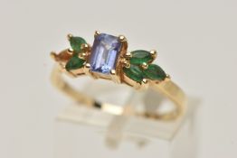 A TANZANITE AND EMERALD RING, rectangular cut tanzanite set with marquise cut emeralds, prong set in