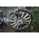 A WEATHERED CART/WAGGON WHEEL, diameter approximately 106cm (condition - weathered, losses to