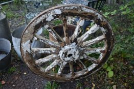 A WEATHERED CART/WAGGON WHEEL, diameter approximately 106cm (condition - weathered, losses to