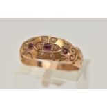 A LATE VICTORIAN 15CT GOLD RUBY AND PEARL RING, flower detail to the centre set with a central