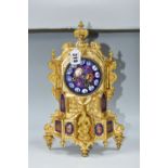 A SECOND HALF 19TH CENTURY FRENCH GILT FIGURAL MANTEL CLOCK, the enamel dial with raised Roman