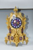 A SECOND HALF 19TH CENTURY FRENCH GILT FIGURAL MANTEL CLOCK, the enamel dial with raised Roman